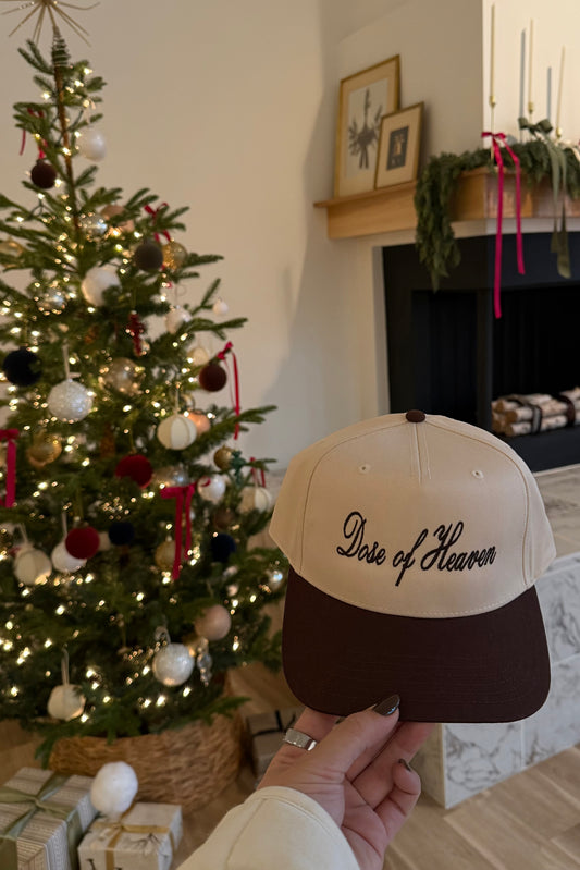 Beige and brown cap with 'Dose of Heaven' embroidered, perfect for casual wear and outdoor activities.