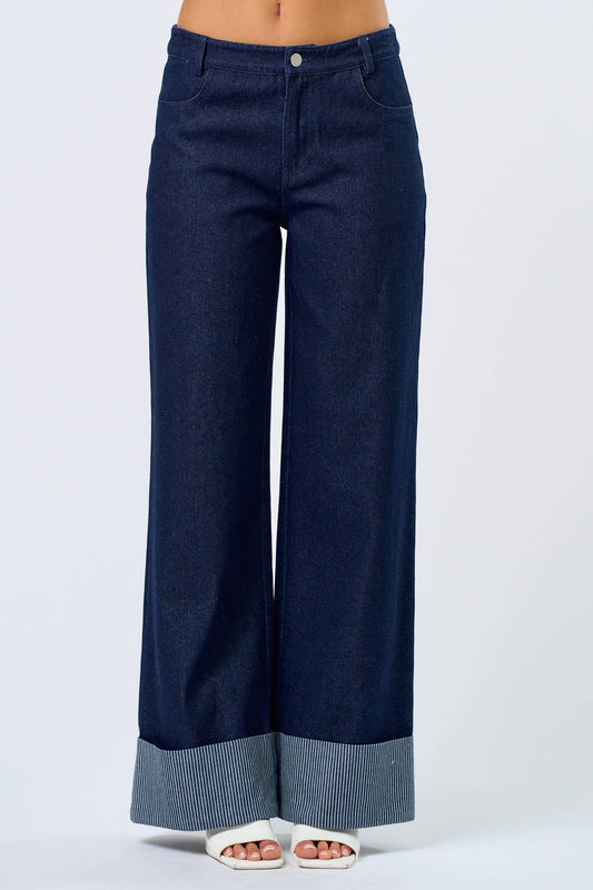 Wide-leg dark denim pants with striped cuffs, perfect for casual and stylish outfits.