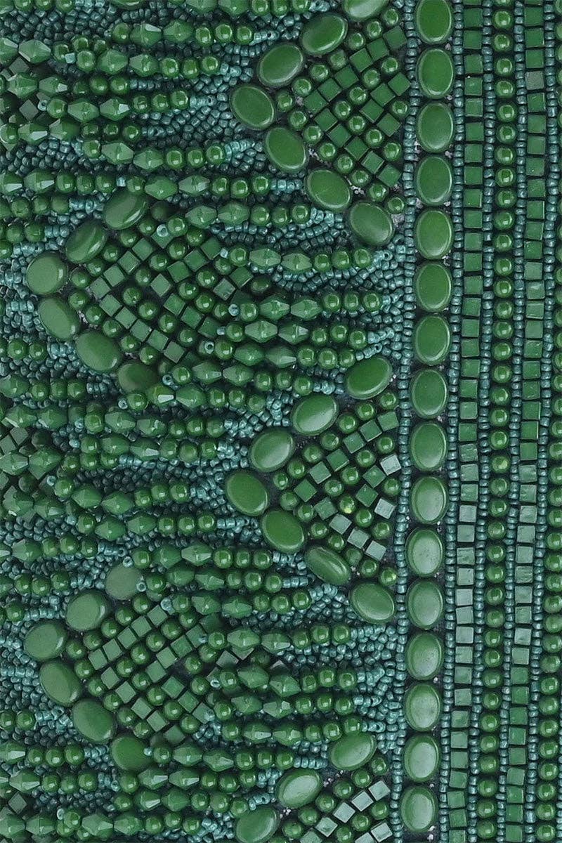 Close-up of green textured fabric with a pattern