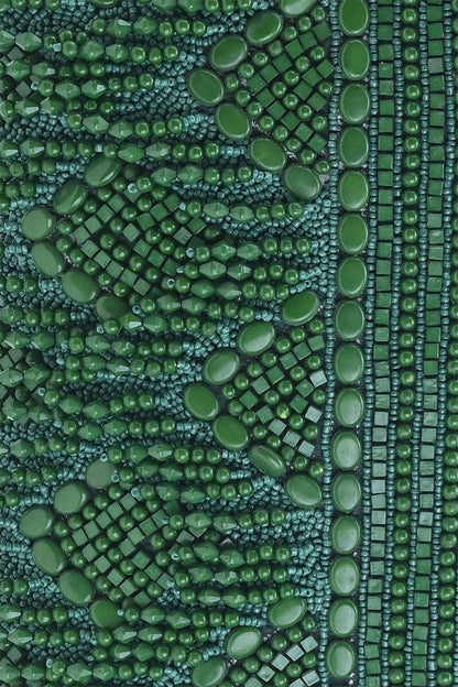 Close-up of green textured fabric with a pattern