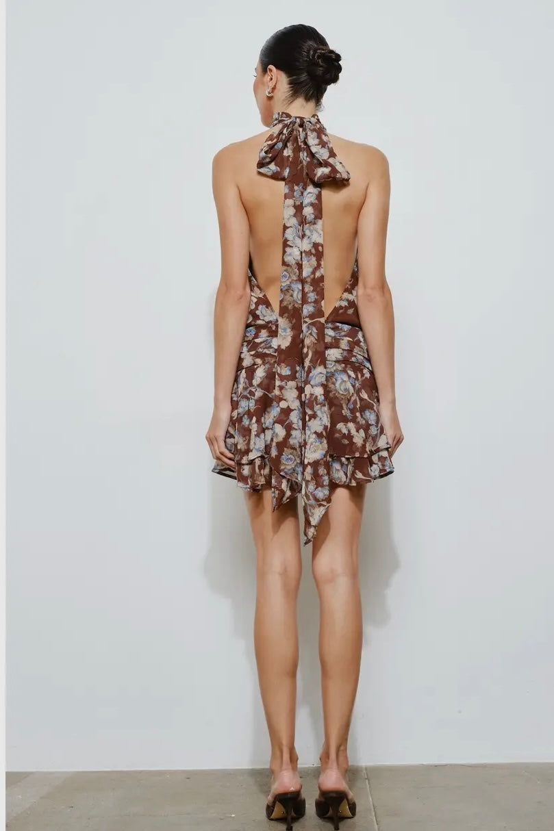 Brown floral halter dress with open back and ruffled hem, perfect for summer events.