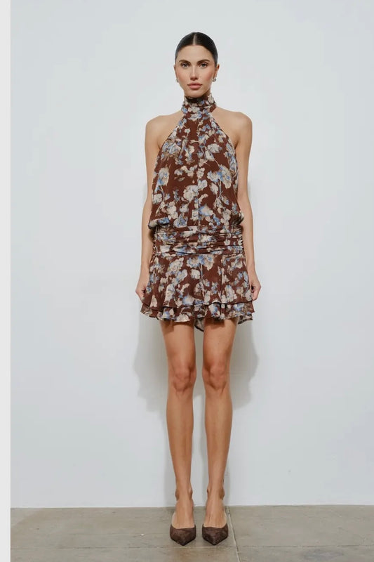 Brown floral halter neck dress with ruffled hem, perfect for stylish summer outings.