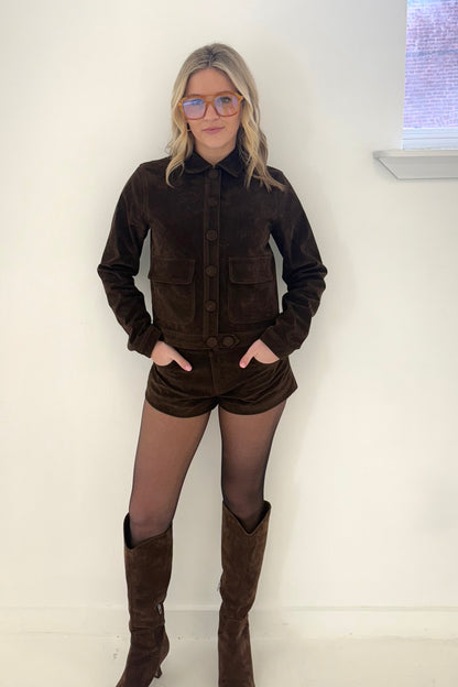 Brown suede jacket and shorts set with button details, stylish and trendy fashion look.