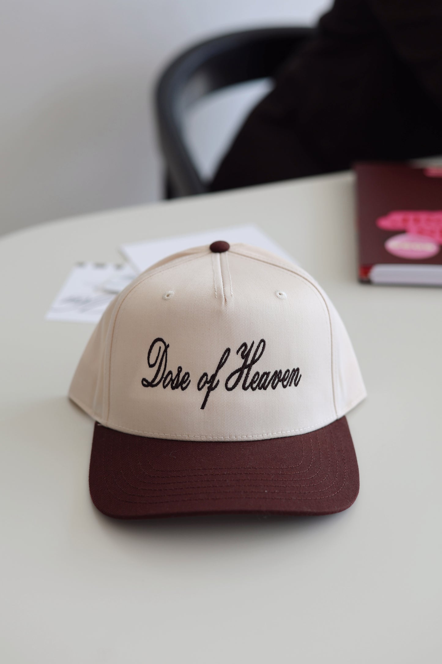 Cream baseball cap with brown brim and 'Dose of Heaven' embroidered on front.
