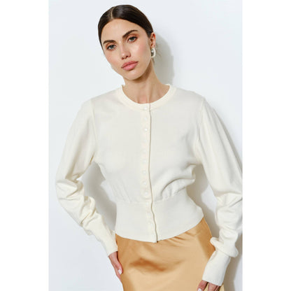 Cream button-up cardigan made of soft knit material, featuring a fitted waist and long sleeves.
