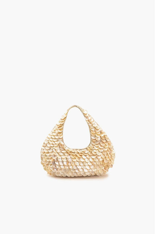 Gold woven handbag on a white background